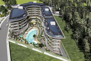 Alanya woning: Elegante woonkamer en keuken met marmeren vloeren en gouden accenten, wat een luxueuze sfeer creëert.