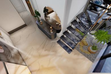 Elegant Alanya entryway features marble floors, a console table with mirror, and a modern marble staircase.