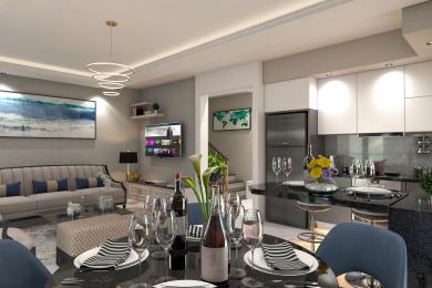 Alanya property featuring an open-plan living and dining area with a modern kitchen, sleek surfaces, and warm, inviting lighting.