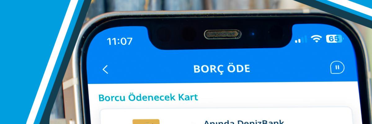 Плащане на сметки онлайн в Алания, Турция; DenizBank Gold MasterCard на екрана на смартфон.